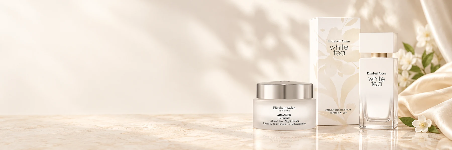 Elizabeth Arden White Tea fragrance and Advanced Ceramide night cream on ivory stone